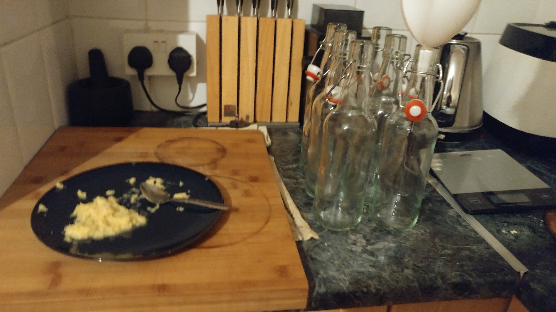 Grated ginger with bottles ready to be filled